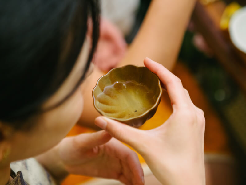 Woman holding a delicate Japanese tea cup